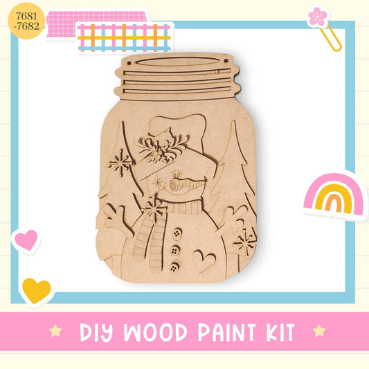 a DIY wood paint kit, which includes a mason jar with a snowman design and various other decorative elements.
