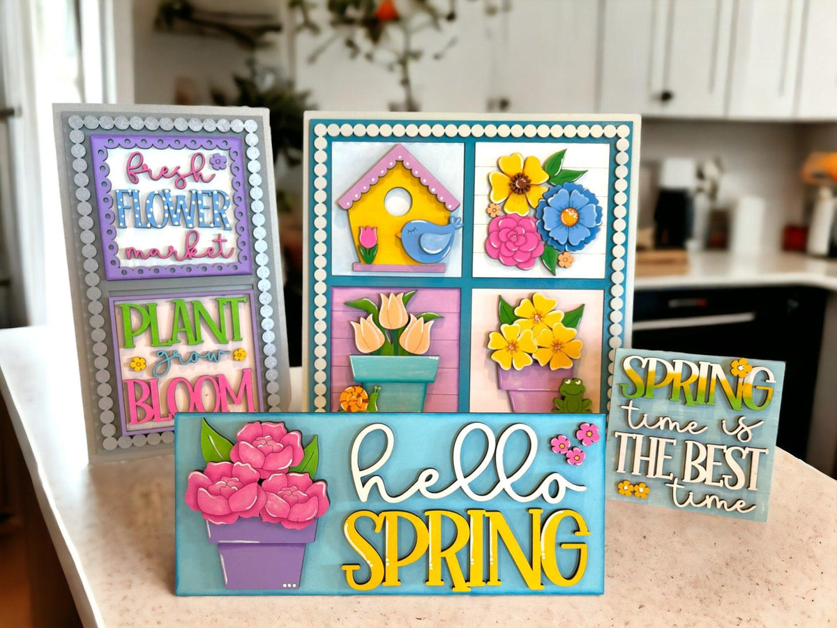 a table topped with cards and flowers on top of a counter