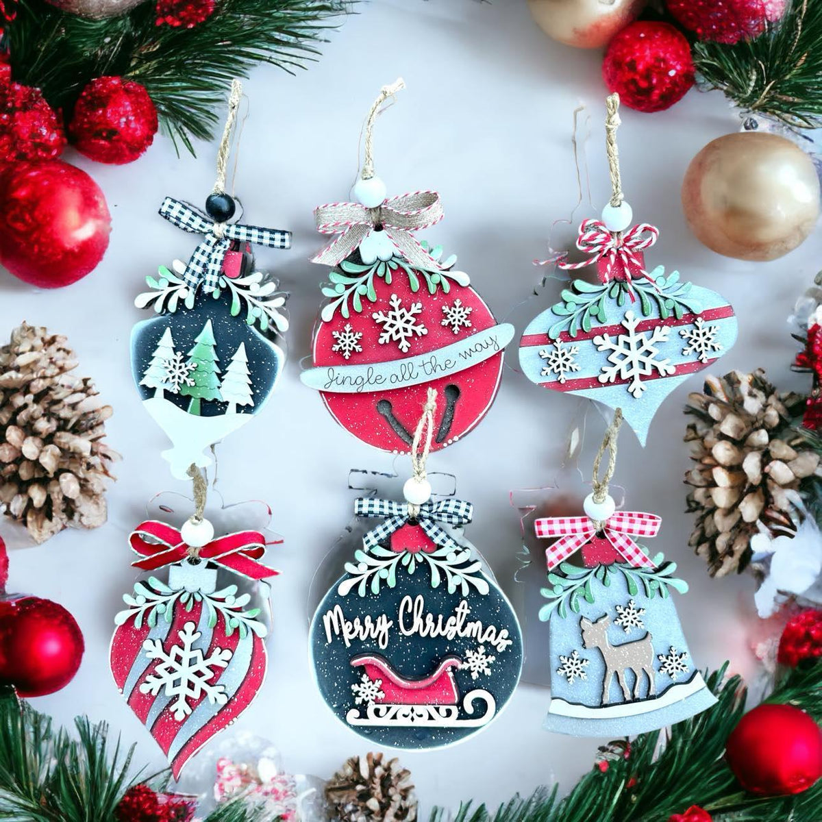 a group of christmas ornaments hanging from a christmas tree