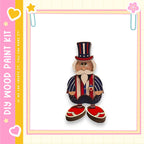 A wooden toy figure of a patriotic figure wearing a top hat and striped jacket, standing against a white background.