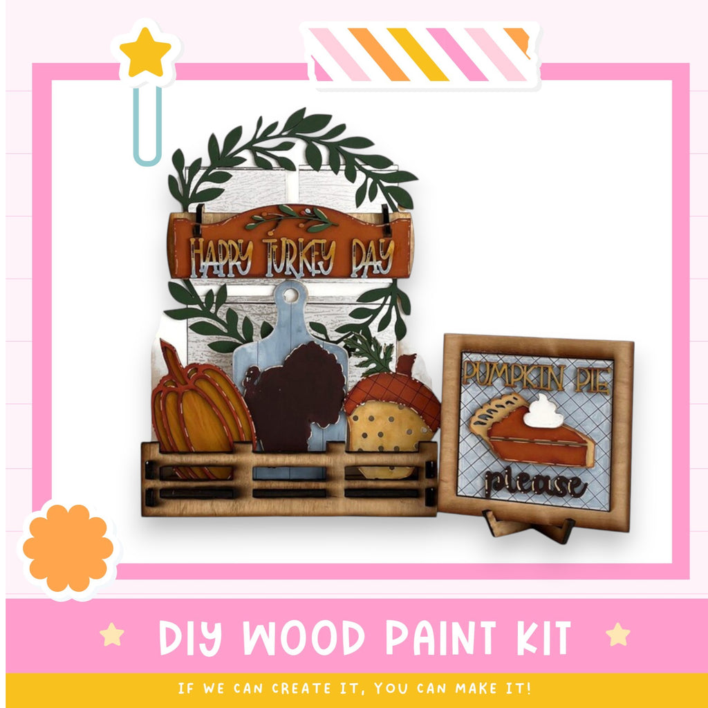 a wooden painting kit with a turkey and pumpkin