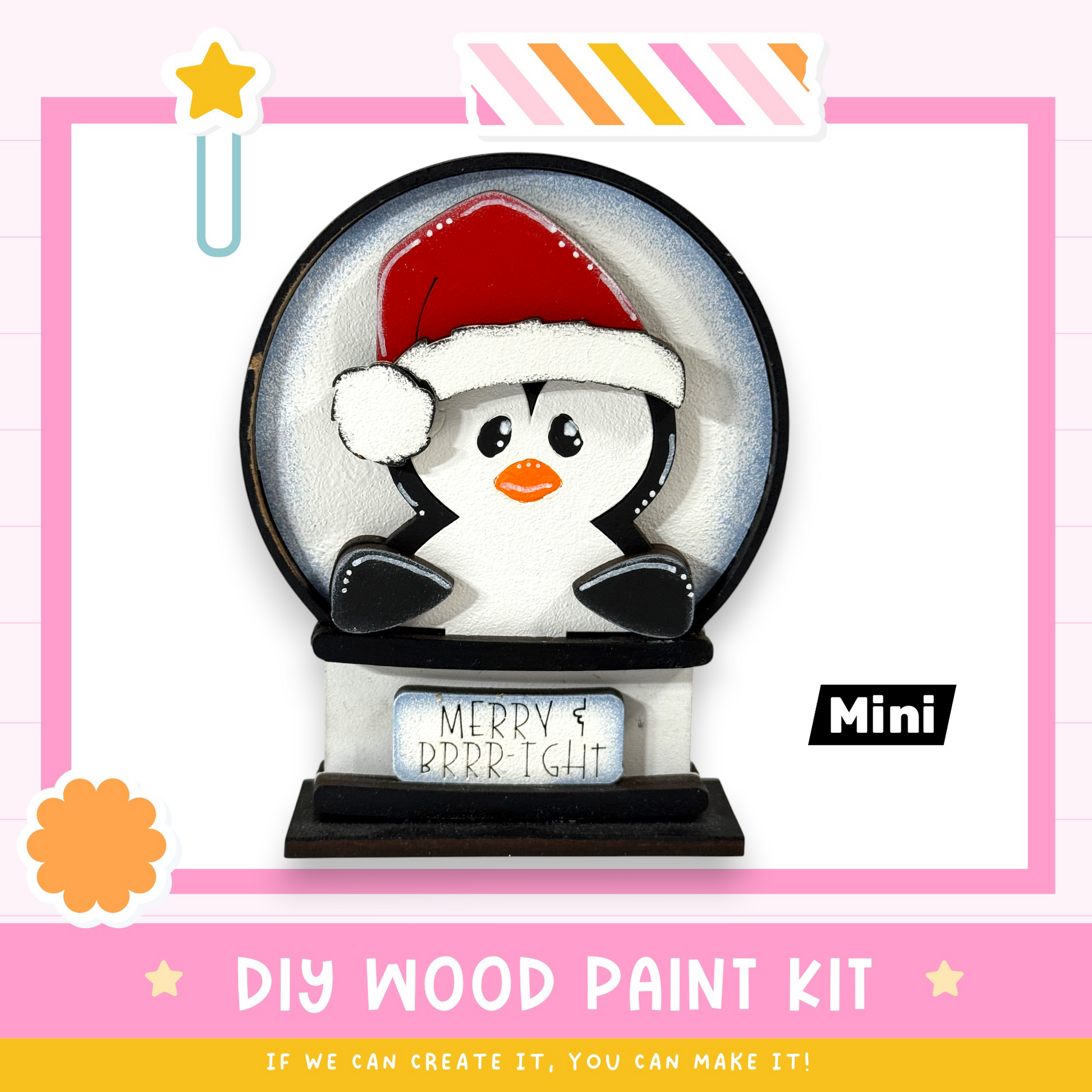 A DIY wood paint kit for creating a wooden snow globe with a penguin design, featuring a sign that says "MERRY & BRRRRIGHT".