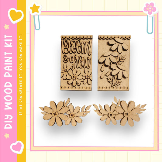 two wooden cutouts of flowers and leaves, along with a pink and yellow border and decorative elements such as hearts and stars.