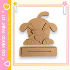 a wooden craft kit, specifically a dog-shaped piece of wood, which can be used for various creative projects.