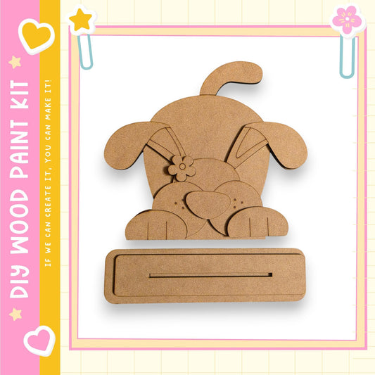 a wooden craft kit, specifically a dog-shaped piece of wood, which can be used for various creative projects.