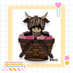a card with a picture of a stuffed animal in a basket