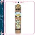 a wooden sign with a floral design and the word "DAISY" written on it.