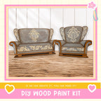 two ornately decorated wooden chairs with intricate floral patterns on their upholstery, set against a white background.