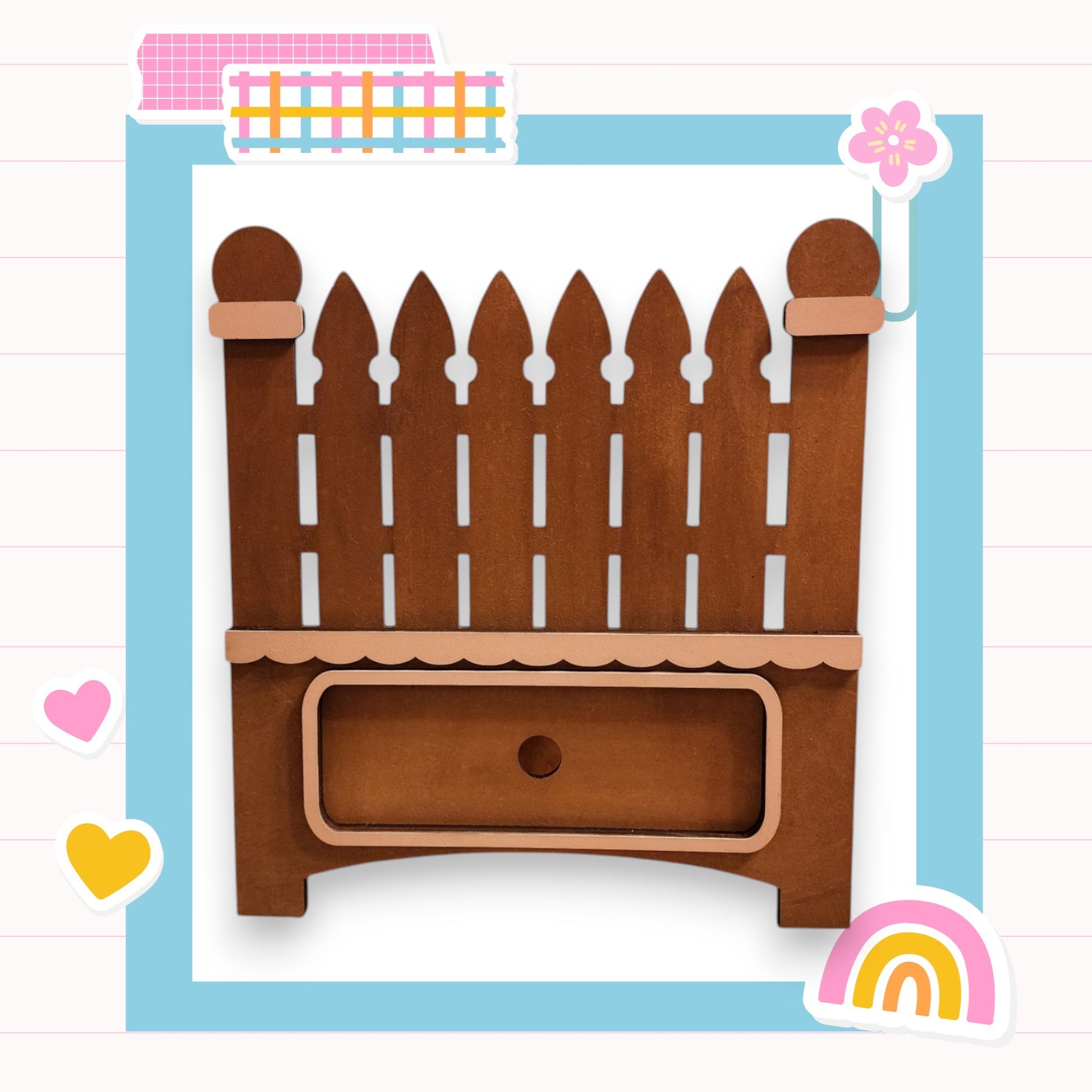 a wooden toy bed with a wooden picket fence