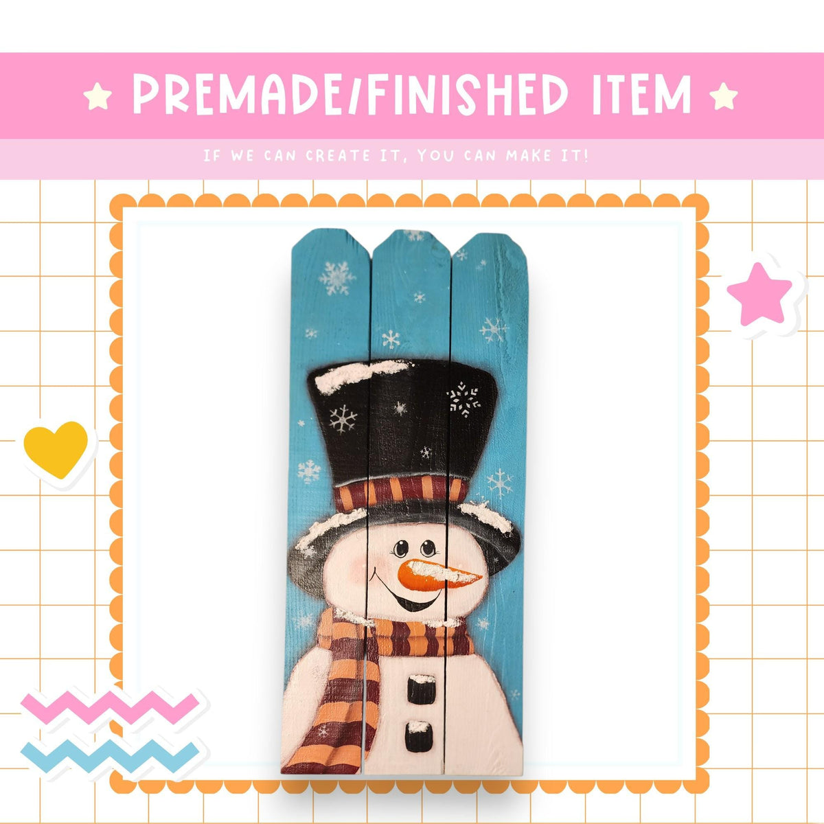 a snowman painted on a wooden board, surrounded by decorative elements such as snowflakes, hearts, and stars.