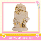 a DIY wood paint kit, with a wooden Santa Claus figure as the main focus. The kit appears to be made of wood and is designed for creating wooden decorations or figures.