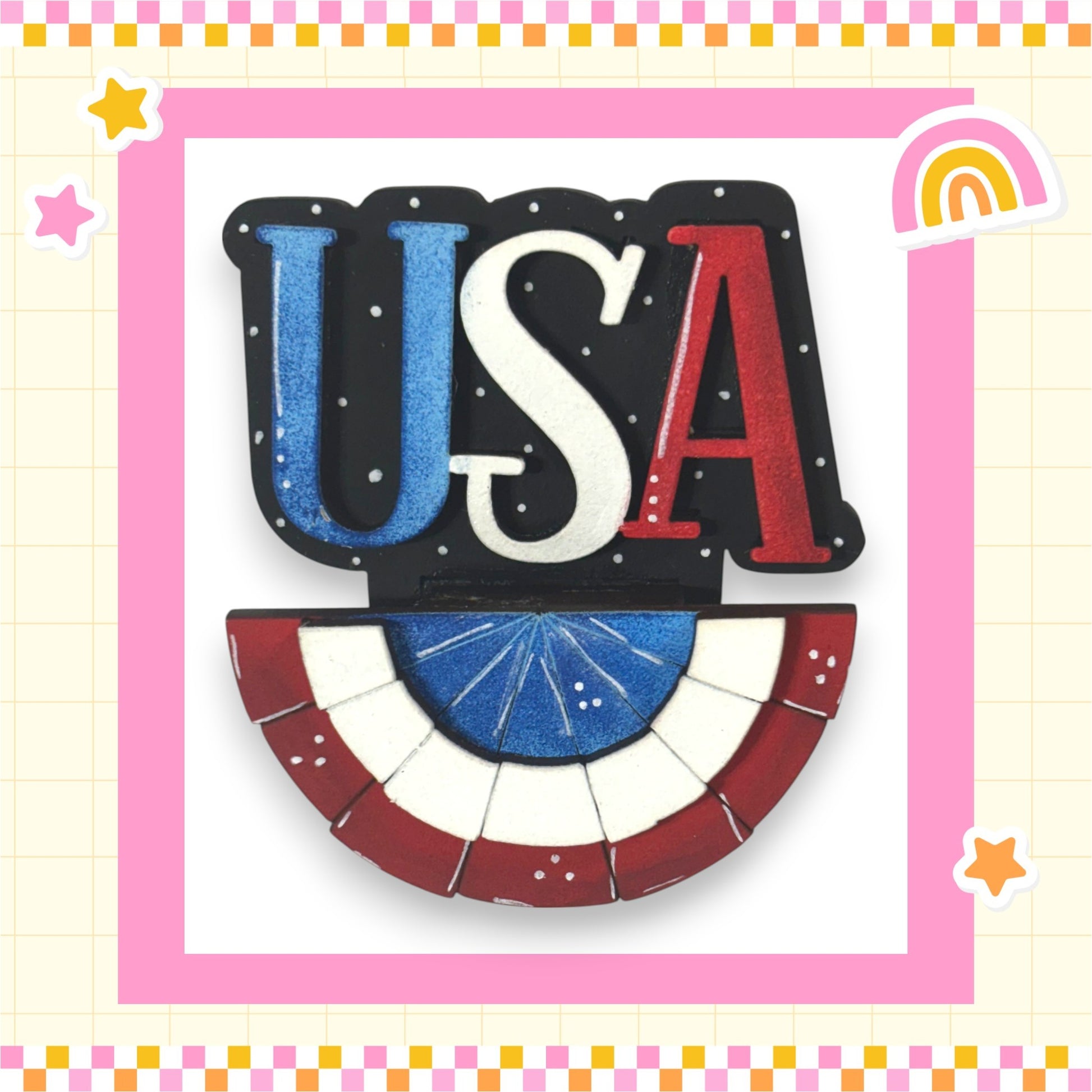 a patriotic design with the word "USA" prominently displayed in the center, surrounded by a decorative border. The design includes a flag-like shape and a fan-like shape, both in red, white, and blue colors. The background of the image is pink and yellow, creating a cheerful and festive atmosphere.