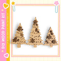 three wooden Christmas trees with snowflake decorations, arranged in a row against a white background.