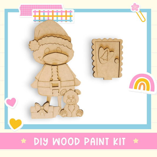 a wooden cutout of a person holding a teddy bear