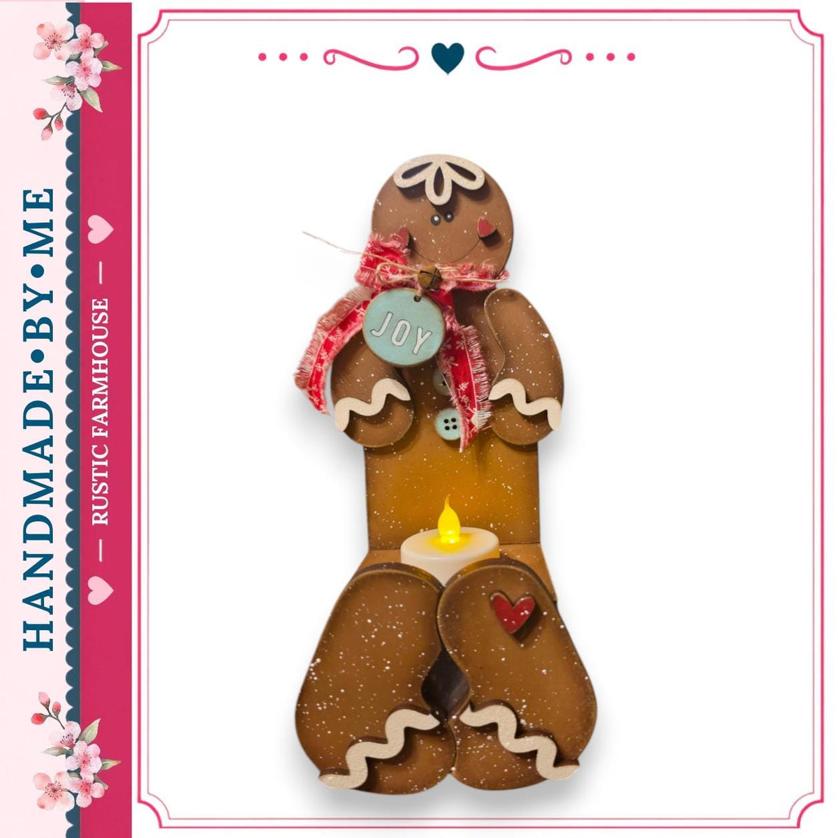 A handcrafted gingerbread man figure with a candle in its lap, set against a white background.