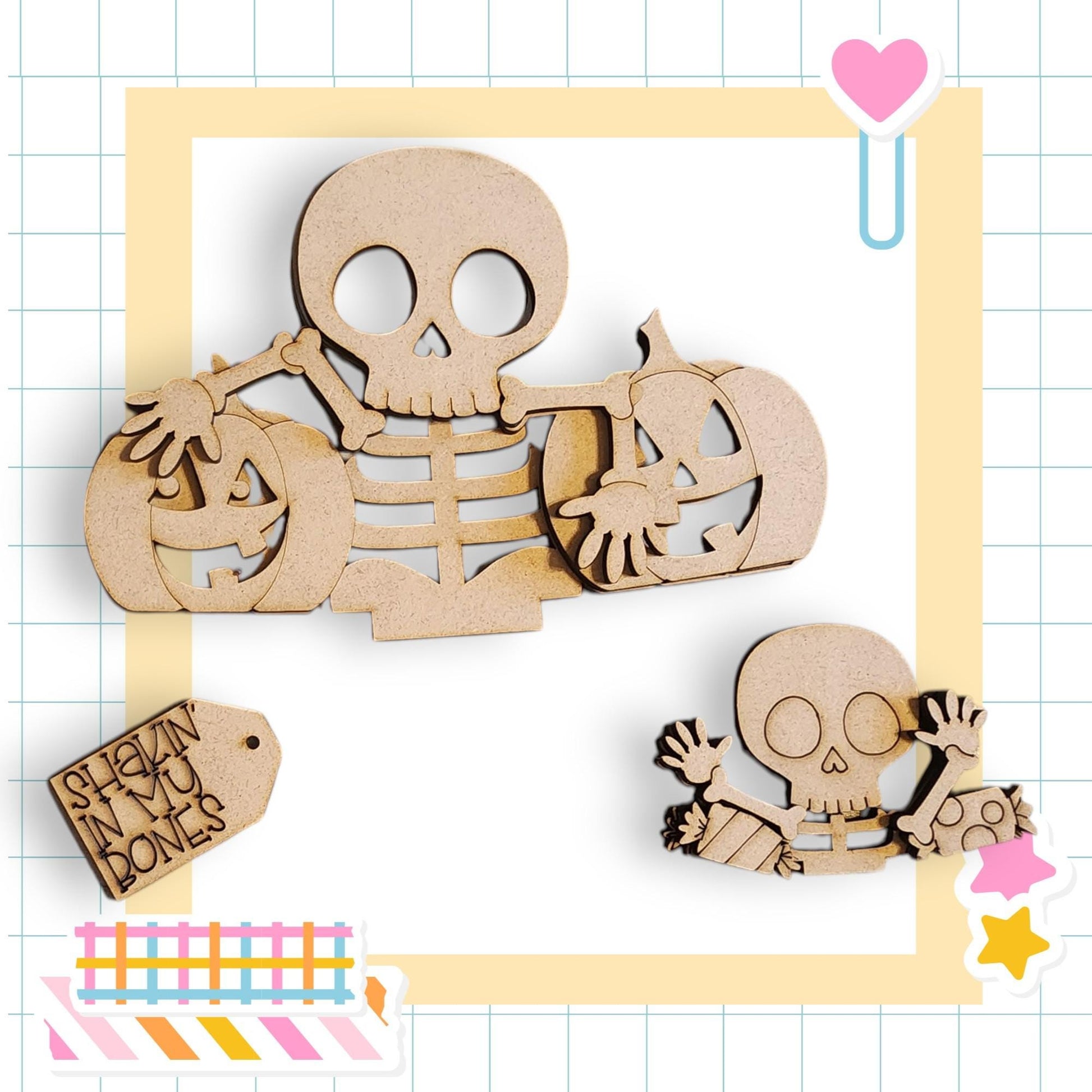 a Halloween-themed collage with various wooden cutouts, including a skeleton holding a carved pumpkin, a smaller carved pumpkin, and a carved pumpkin. The collage is set against a grid background with a heart and a star decoration.