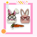a picture of a bunny and a carrot