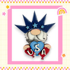 A whimsical illustration of a gnome wearing a crown and holding a heart with the letters "USA" on it, surrounded by stars and a rainbow.