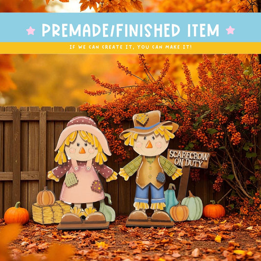 two scarecrow figures standing in front of a wooden fence, with a sign that reads "Scarecrow on Duty". The scene is set against a backdrop of autumn leaves and pumpkins, creating a festive atmosphere.