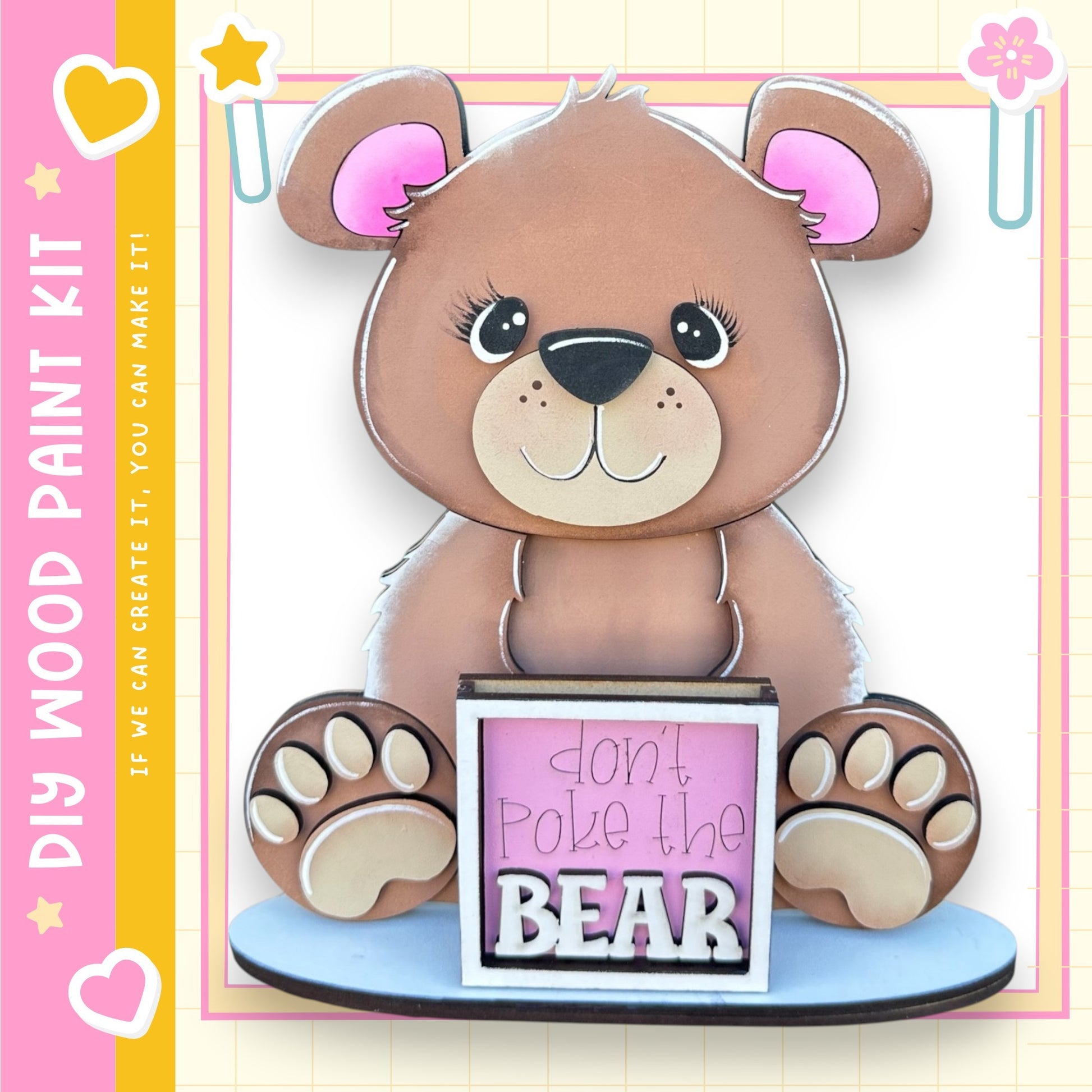 A wooden teddy bear with a sign that says "Don't poke the bear" is displayed in the image.