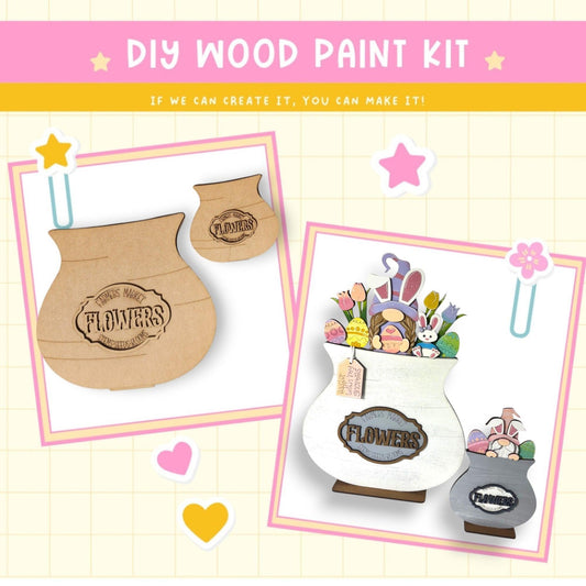 a wooden craft kit with flowers in a vase