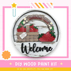 a sign that says welcome with strawberries on it