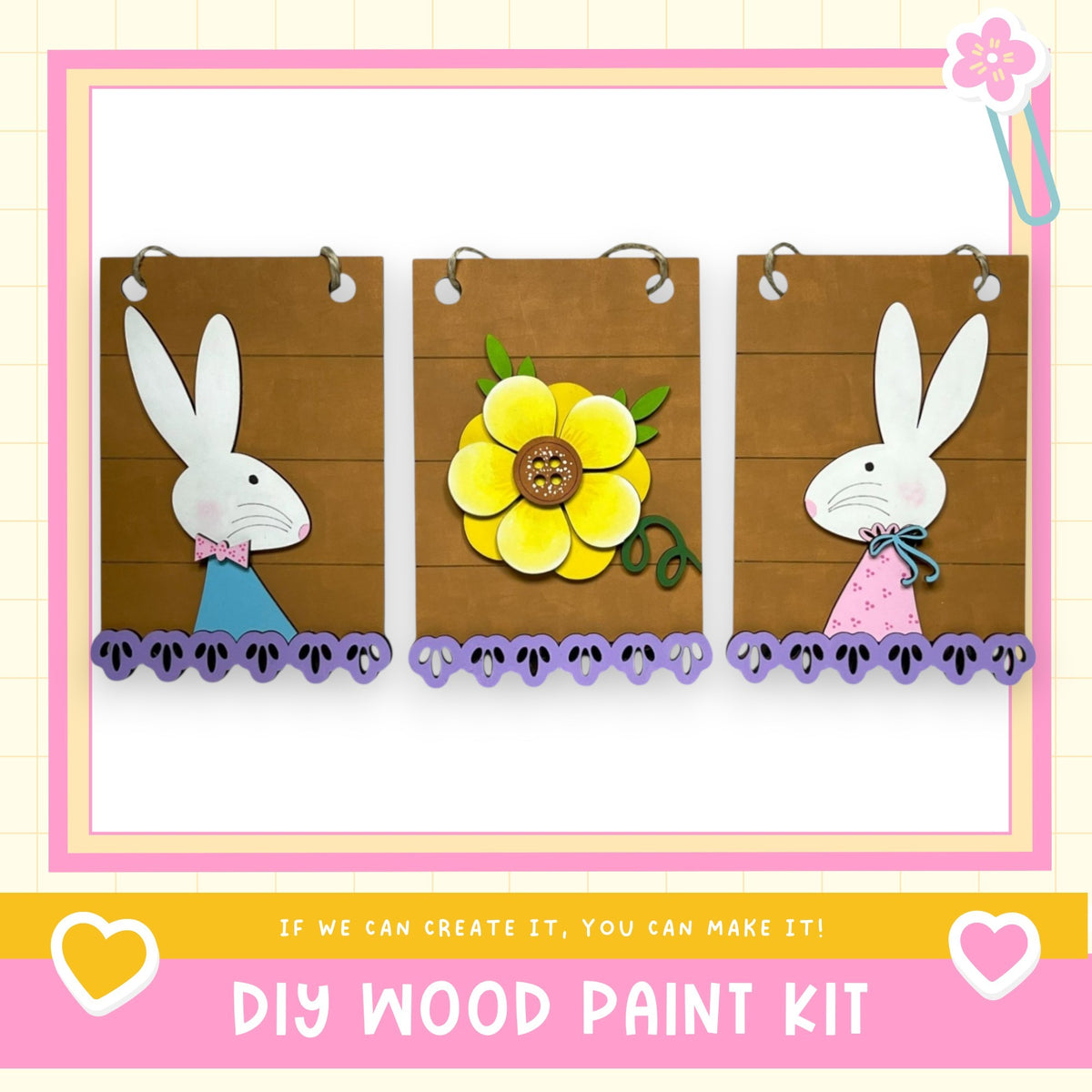 The image is a DIY wood paint kit featuring three wooden panels with illustrations of a white rabbit and a yellow flower. The panels are hanging on a wall, and the image includes text that encourages creating art with the kit.