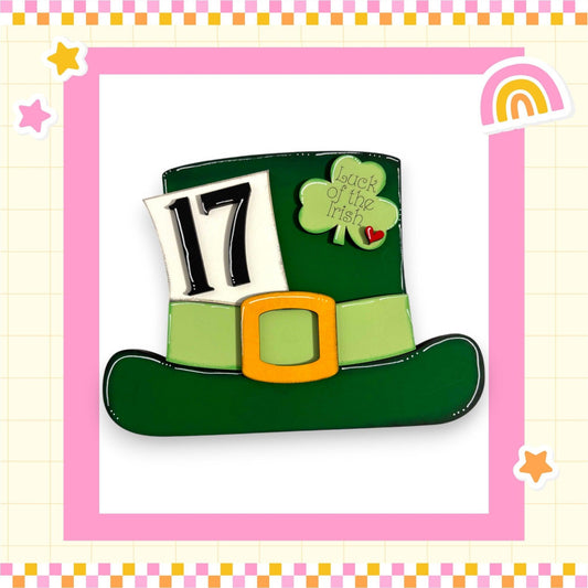 a st patrick's day hat with a rainbow in the background