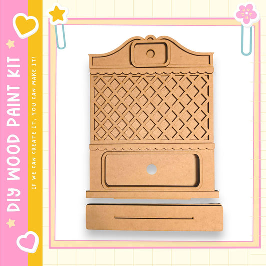 a wooden cabinet or drawer with a decorative design, likely intended for a DIY paint kit.