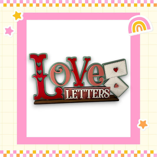 a picture of a love letter with a rainbow in the background