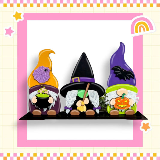 a group of gnomes sitting on top of a shelf