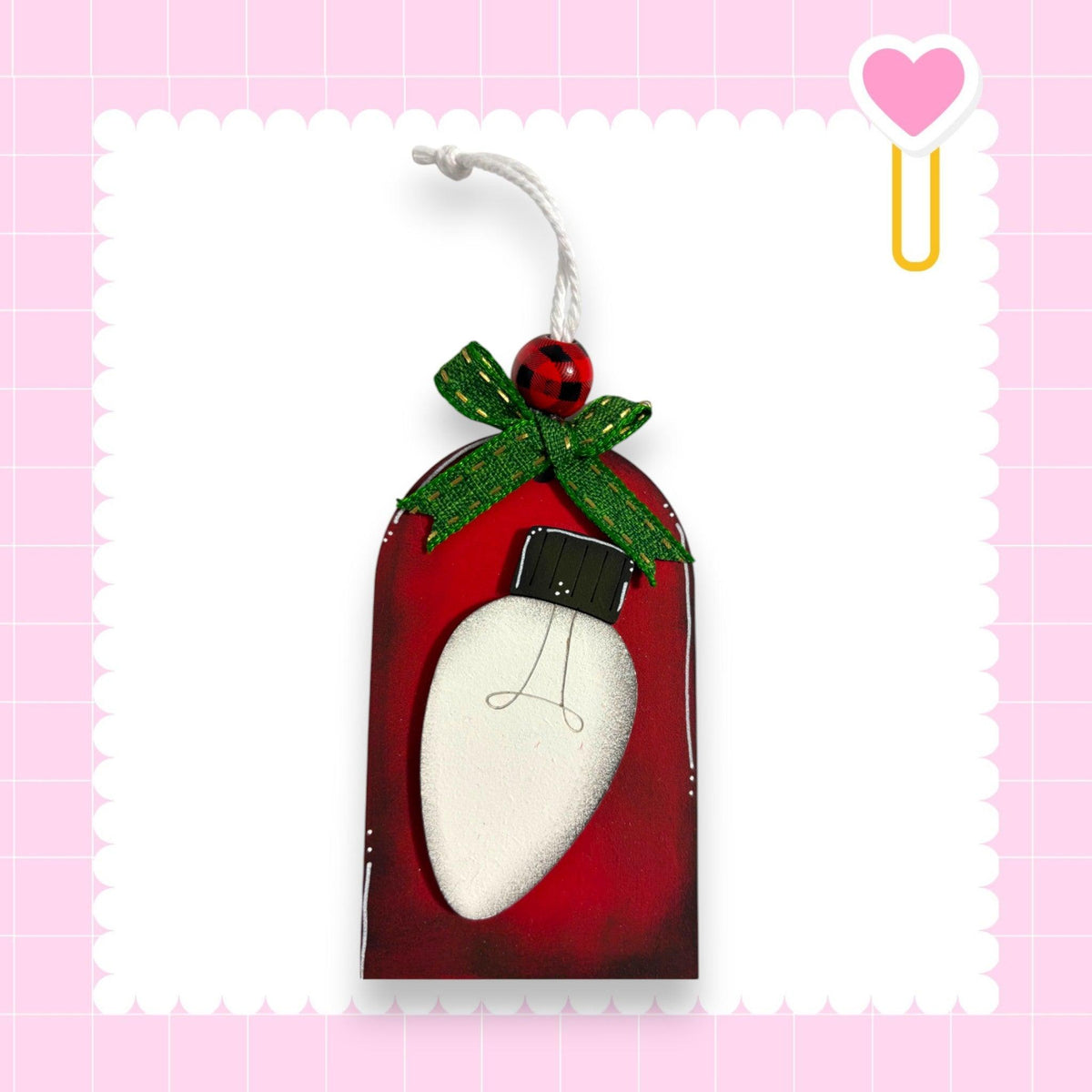 a christmas ornament hanging from a string