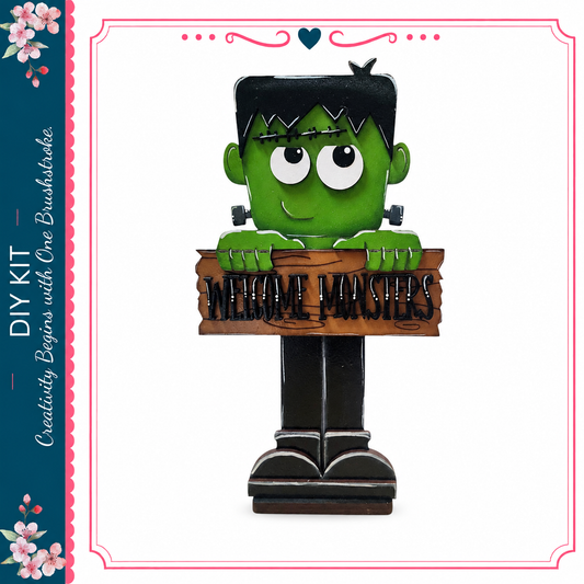 A green monster-like figure holding a sign that says "Welcome Monsters"