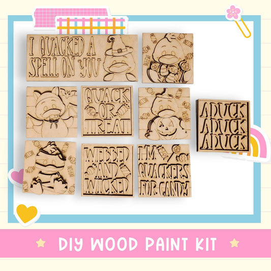 The image is a DIY wood paint kit featuring various carved wooden shapes with text and illustrations related to Halloween and candy themes.