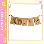 A banner made of wooden letters spelling "HOP" with two bunny ears on either side.