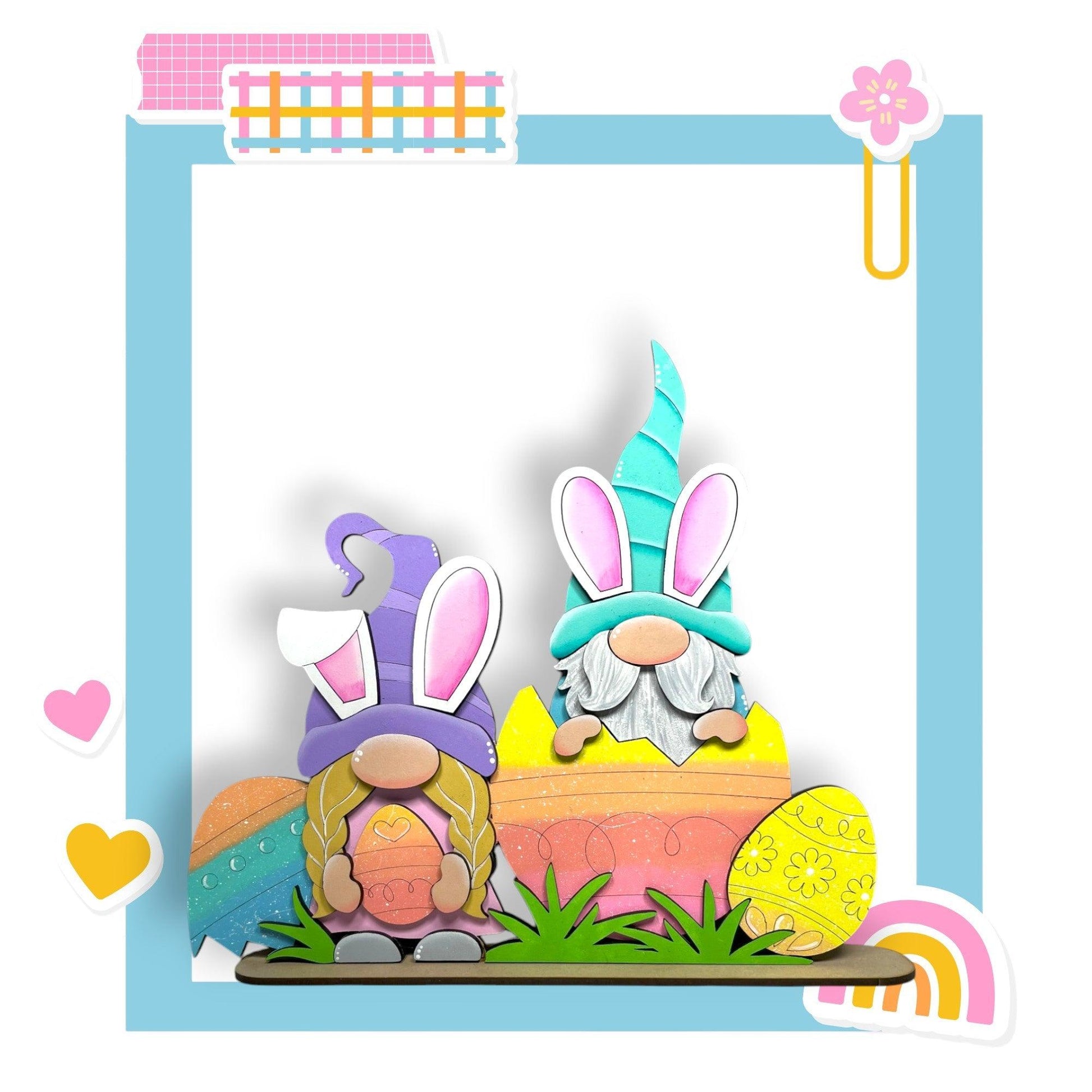 a couple of rabbits sitting on top of a cake