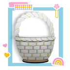 a paper basket with a rainbow in the background