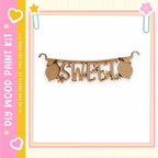 a wooden banner with the word "SWEET" written on it.