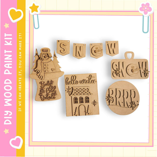 various wooden cutouts and decorations, including a snowman, a banner, and a snowflake-like design.