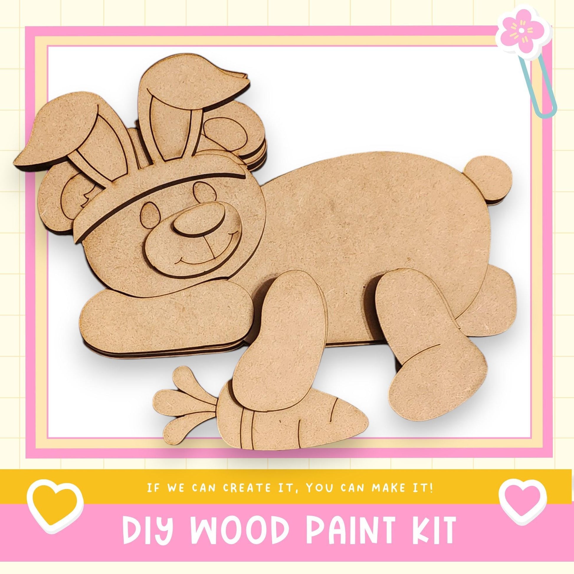 a DIY wood paint kit for creating a wooden toy, specifically a wooden bunny. The kit includes a wooden bunny and a wooden carrot, which can be used to create a wooden toy.