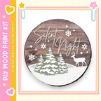 a wooden sign with the text "Silent Night" and a snow-covered forest scene with a deer.