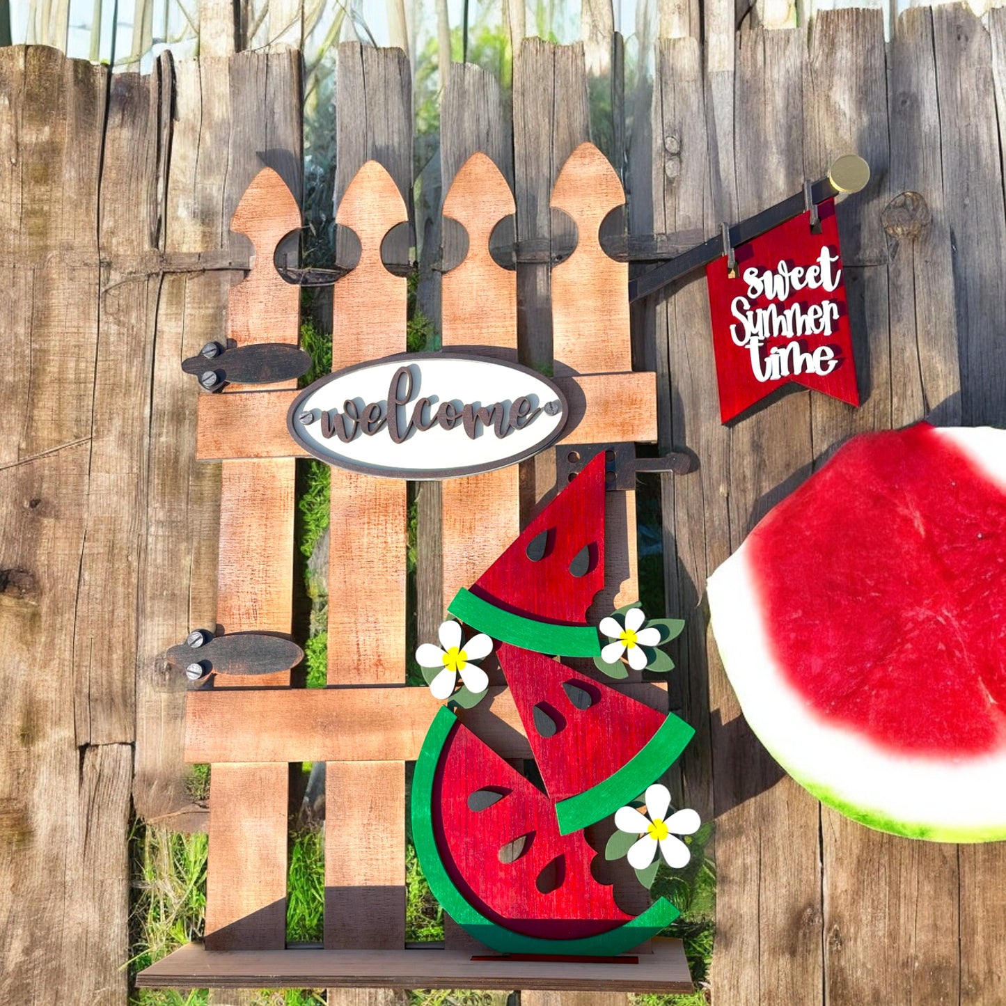 a wooden fence with a watermelon cut out of it