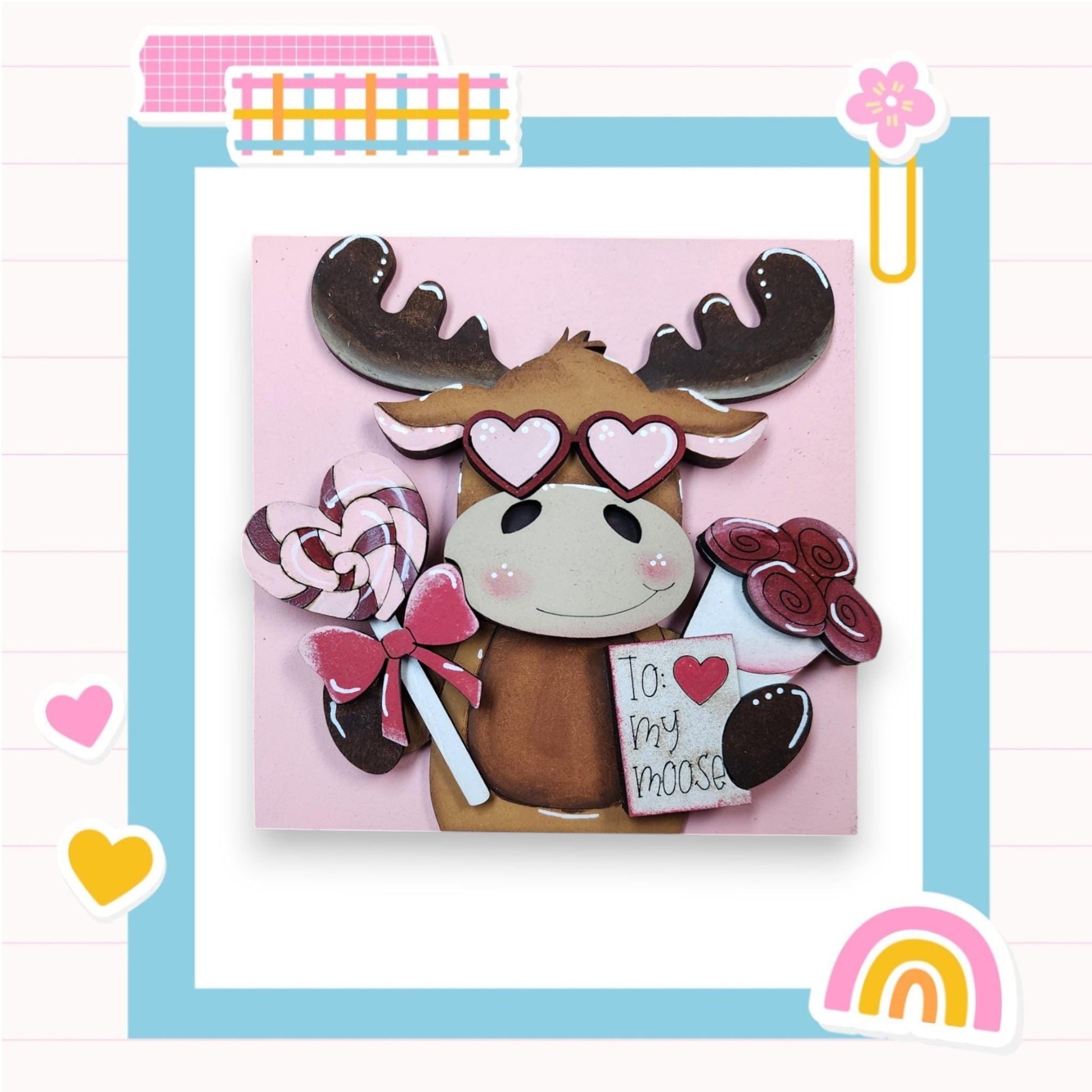 a card with a picture of a moose holding candy