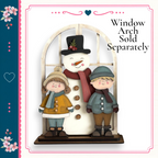 A snowman and two children standing in front of a window, with a heart-shaped design on the left side of the image.