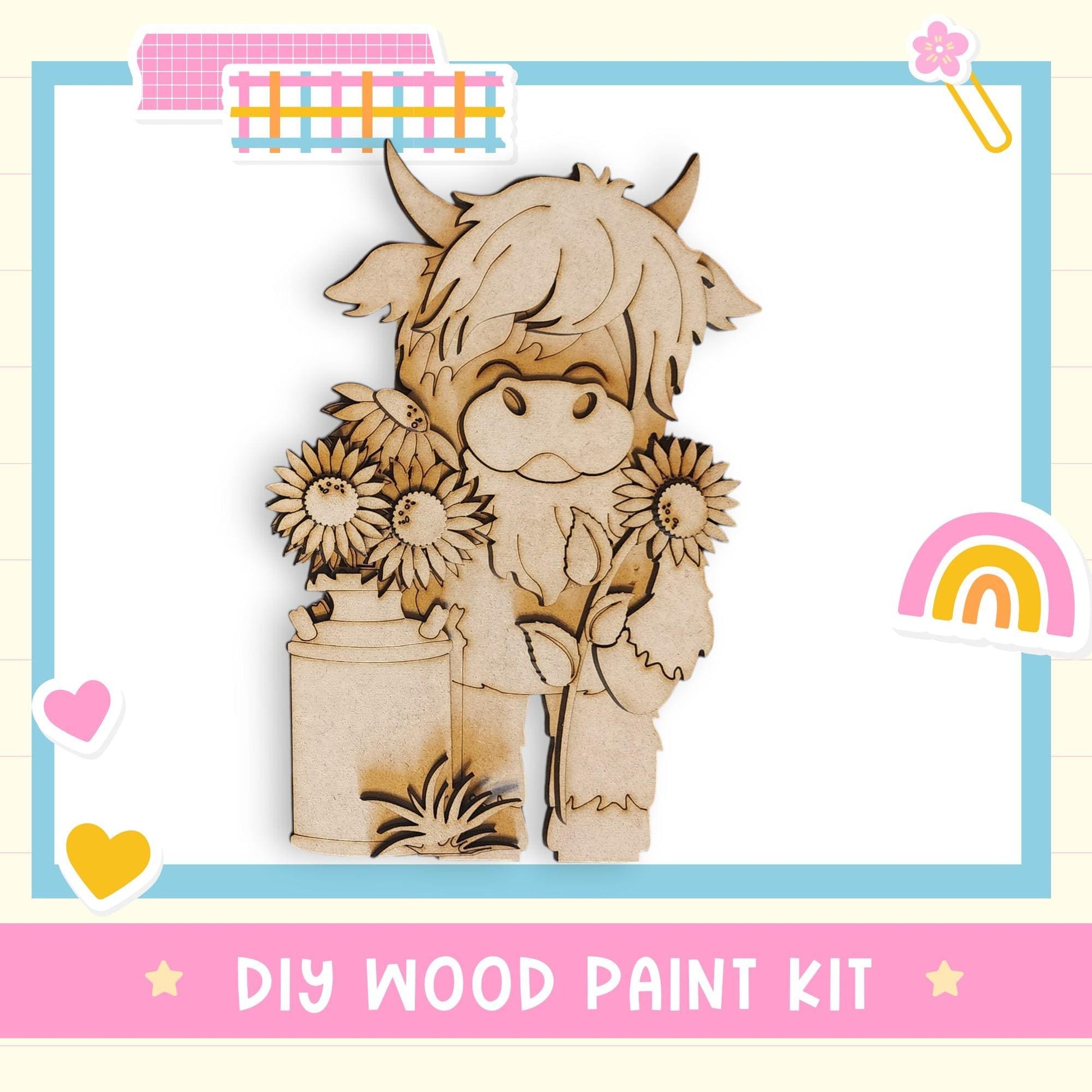 a DIY wood paint kit with a wooden cow holding flowers, surrounded by various colorful stickers and a rainbow.