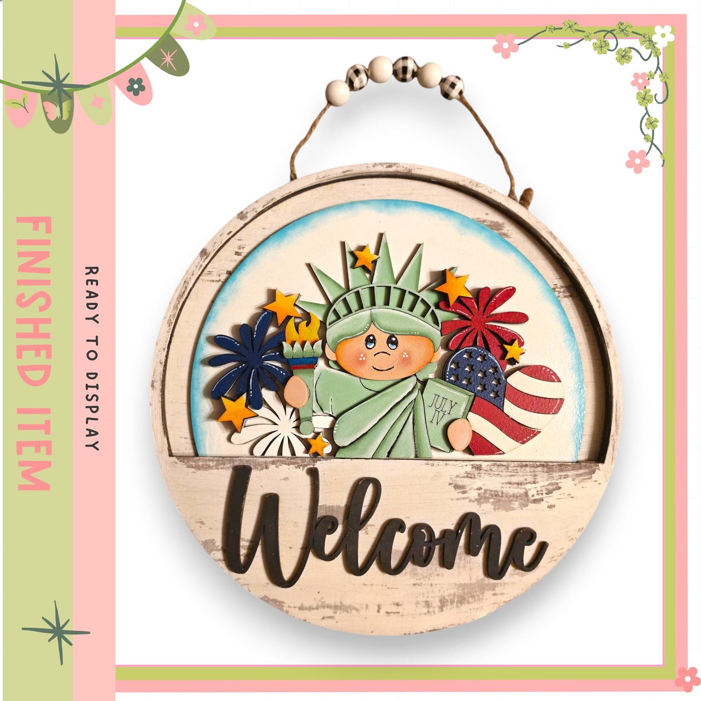 A wooden sign with a cartoon image of the Statue of Liberty and the word "Welcome" written on it.