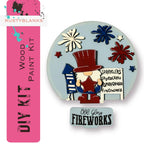 a brooch with a picture of a man in a top hat