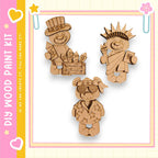 three wooden cutouts of bears, each with different outfits and accessories, displayed against a pink and yellow background.