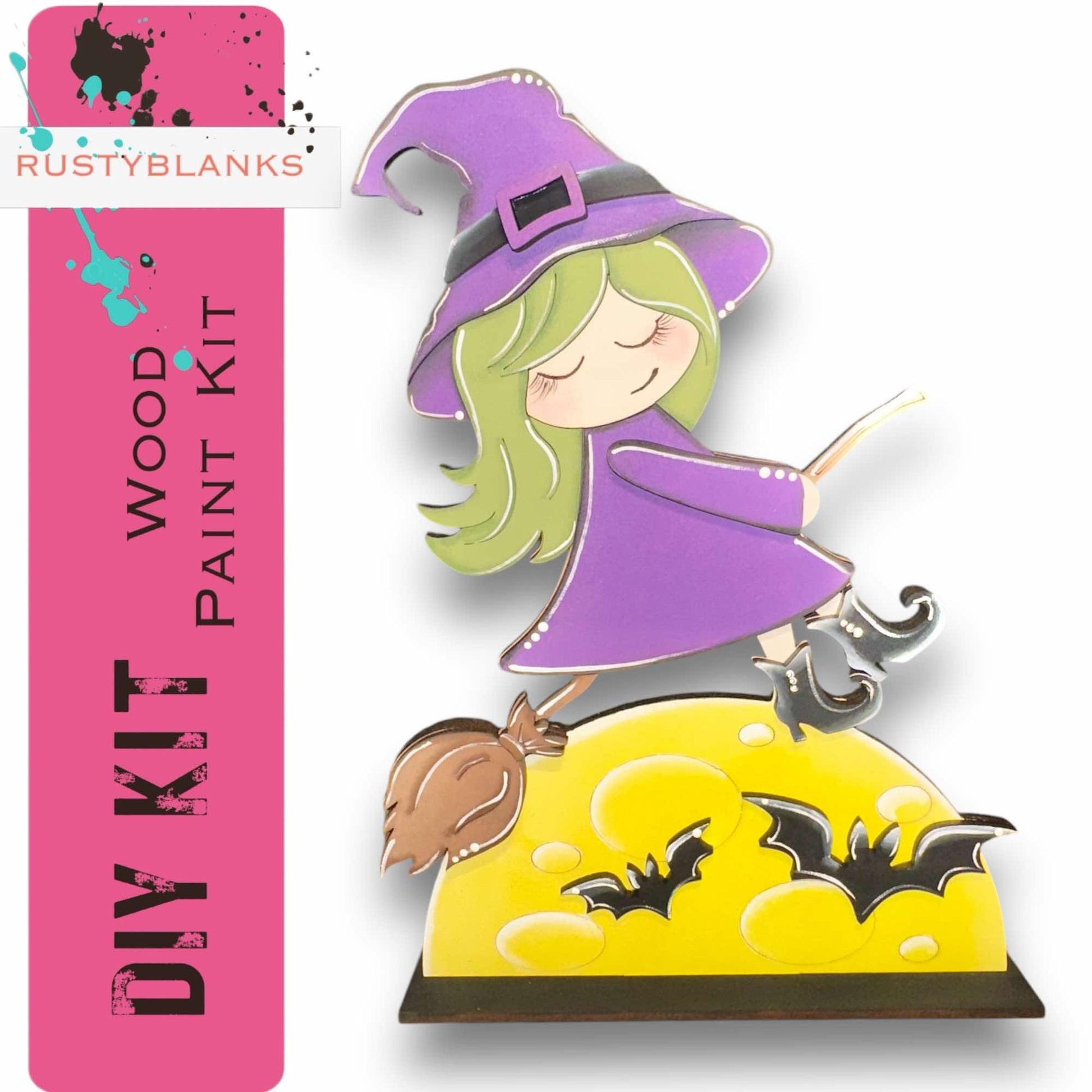 a girl in a witches hat on top of a cake