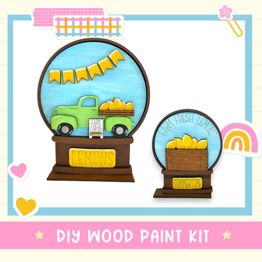 The image is a DIY wood paint kit featuring a lemon-themed design, including a green truck carrying lemons and a lemon-themed basket.